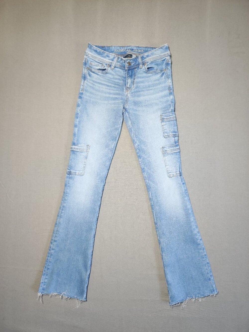 American Eagle jeans women's size 000 hard washed blue distressed boot cut leg